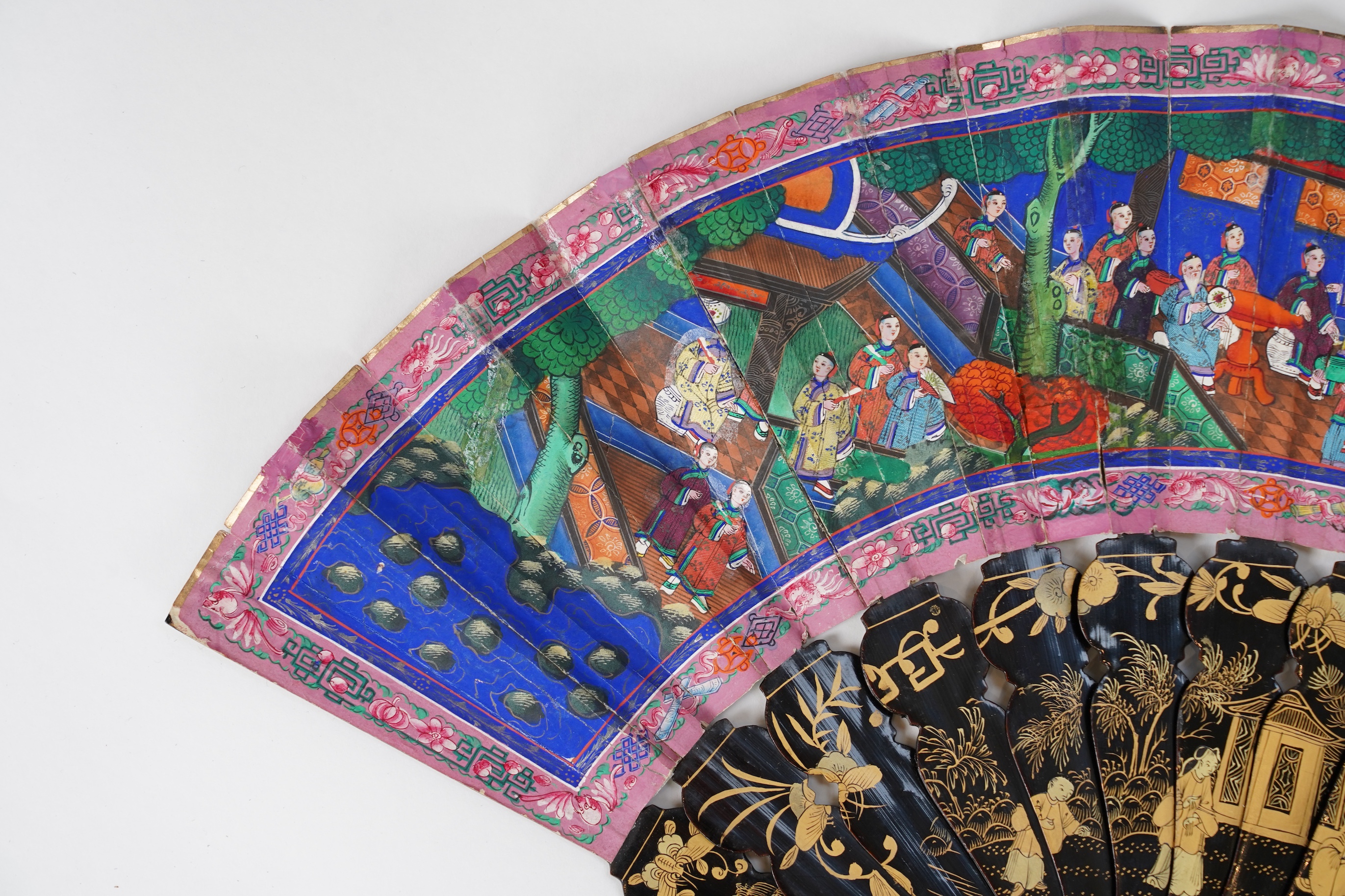 Three Chinese gilt-decorated black lacquer and painted leaf fans, 19th century